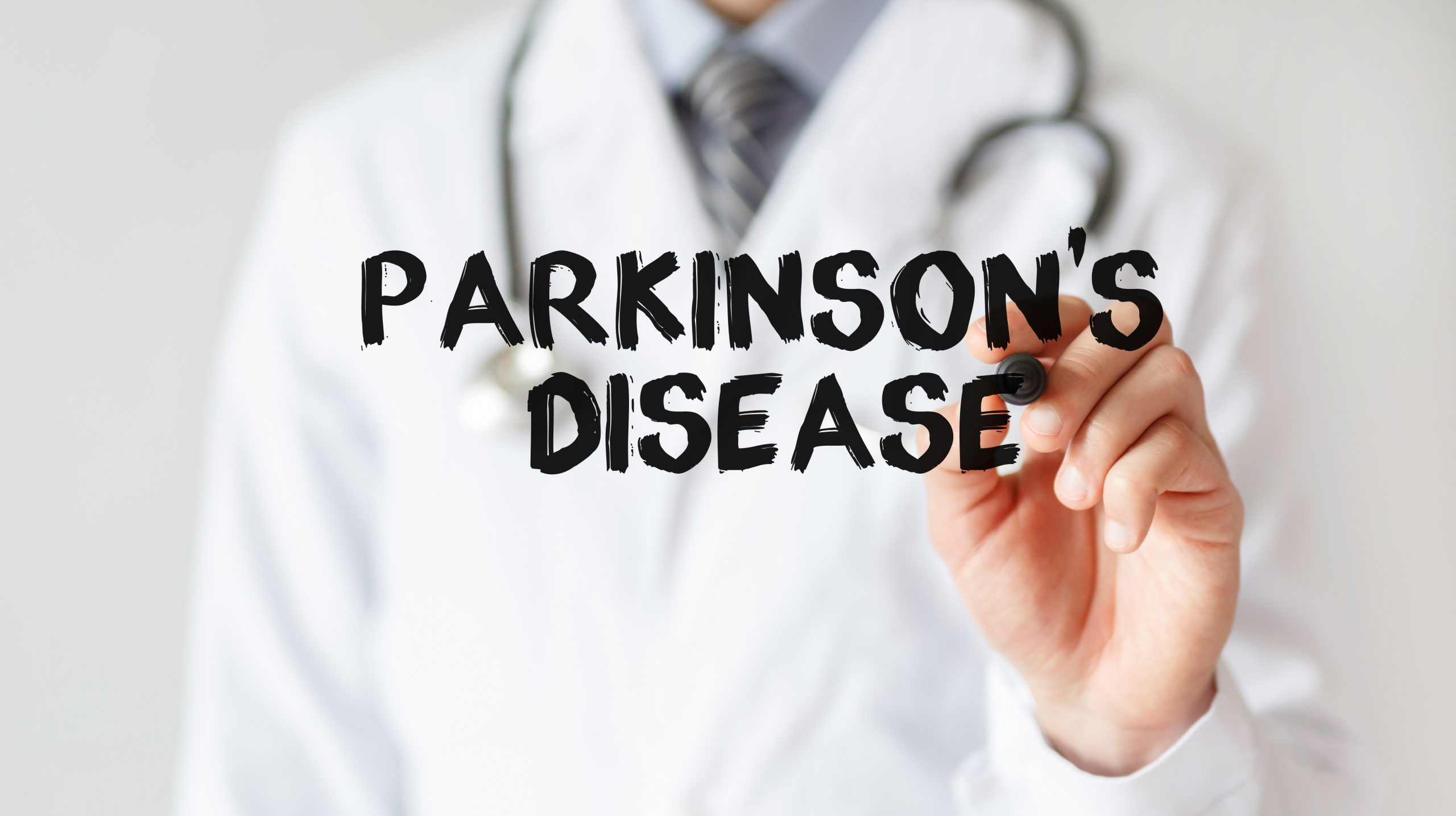 Doctor writing word Parkinson's Disease with marker, Medical concept